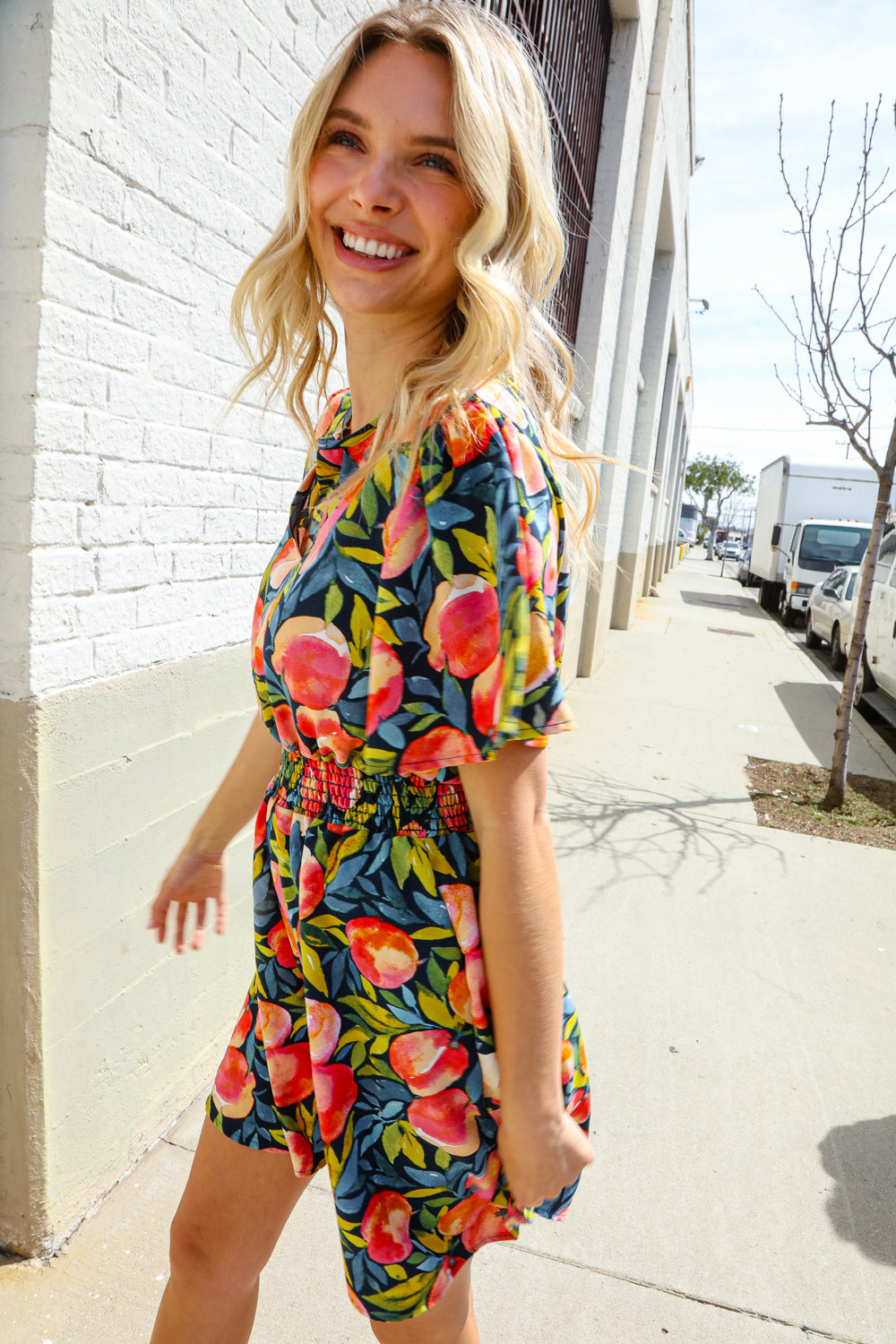 Sunny Days Floral Print Smocked Waist Back Neck Button Romper